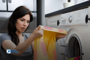 woman looks at marks on her clothes